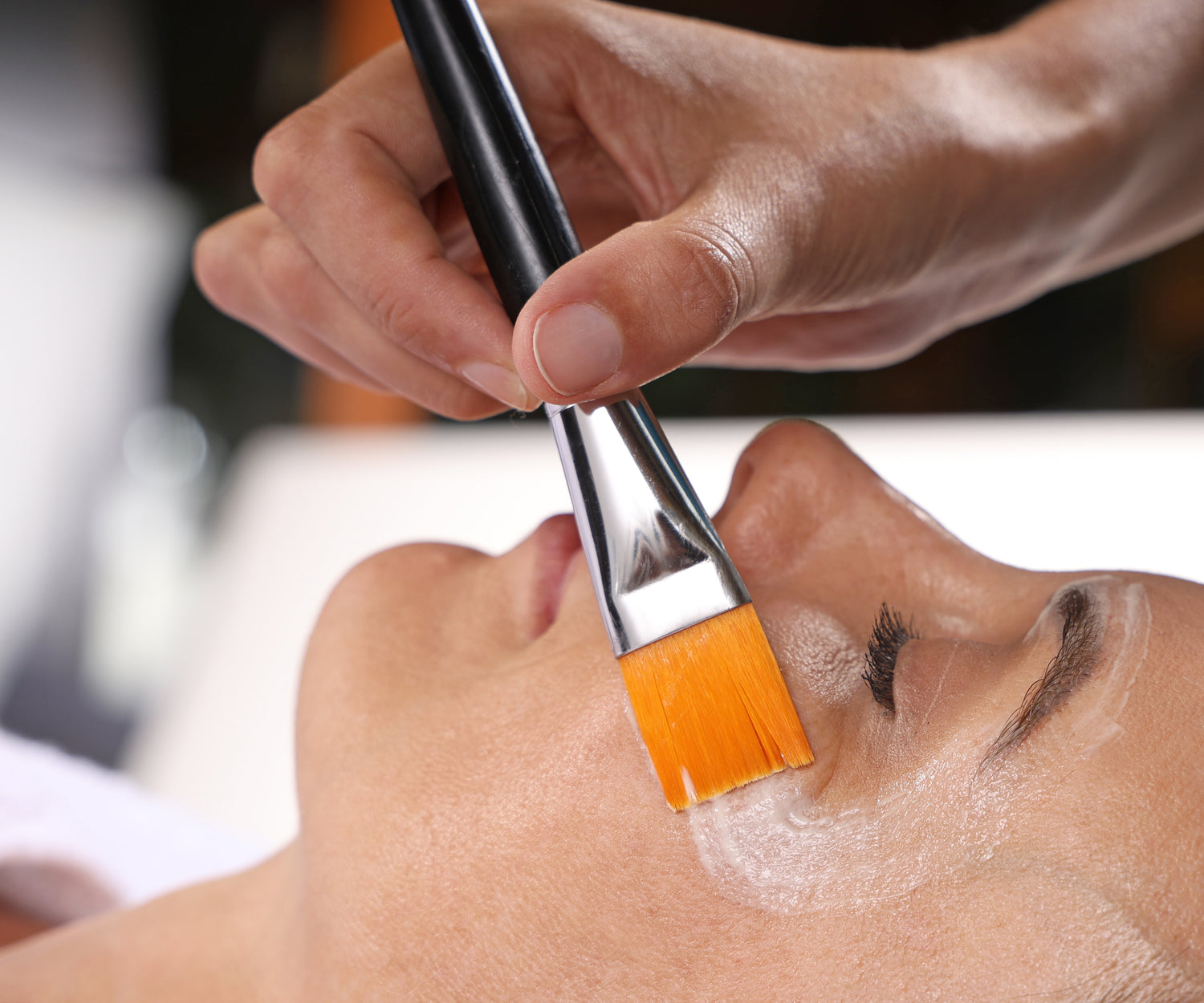 A very relaxed woman experiencing the Esse Experience facial mask at the Eleanor Olsen Facial Clinic in Surrey